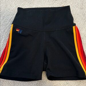 Aviator Nation Black Bike Shorts with Red and Yellow Side Stripes